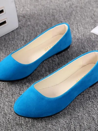 blue flats standing on a grey carpet