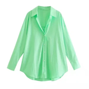 bright green blouse hanging in the air, white background