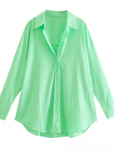 bright green blouse hanging in the air, white background