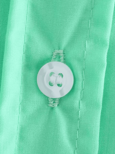 the button of bright green blouse