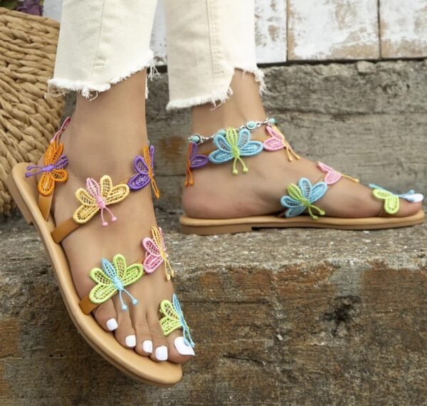 woman walking in butterfly sandals on the stairs