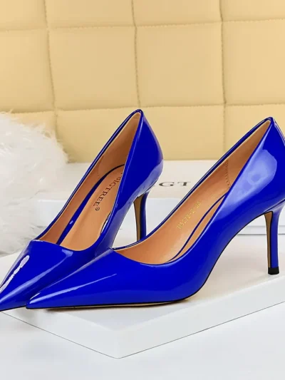 dark blue heels standing on a white carpet