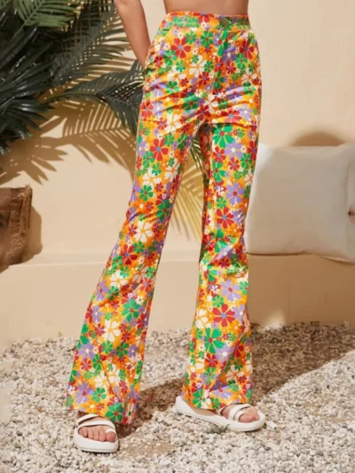 woman wearing floral wide leg pants and keeping her hand in their pocket