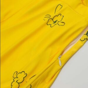 the zipper and the fabric of la la land yellow dress