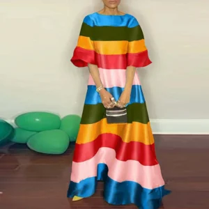 long striped dress on a model front view, beige wall in the background