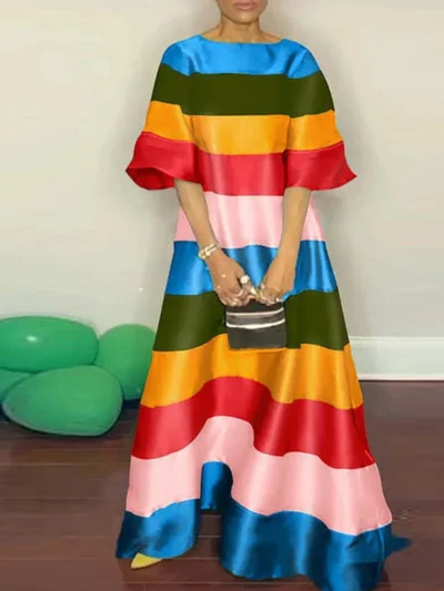 long striped dress on a model front view, beige wall in the background