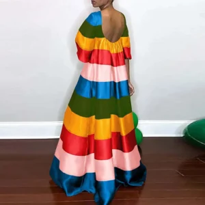 long striped dress back view on a model, white wall in the background