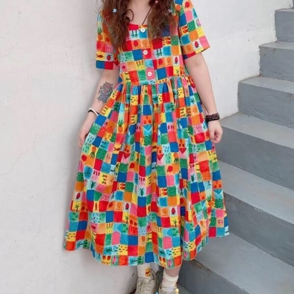 multicolor dress front view on a woman, grey stairs in the background