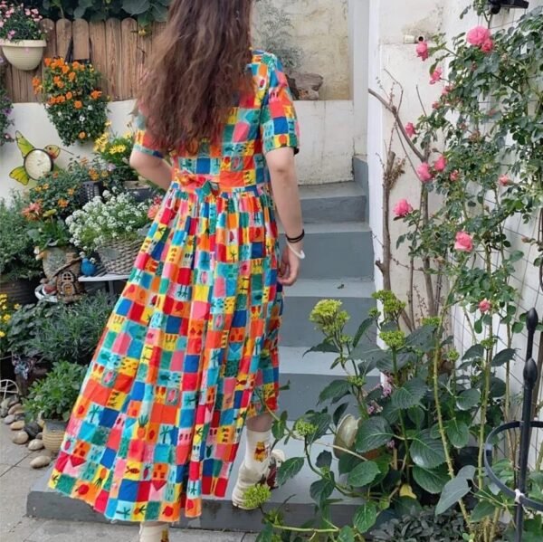 woman wearing multicolor dress, back side of the dress visible