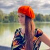 woman wearing orange beret and black dress with orange flowers