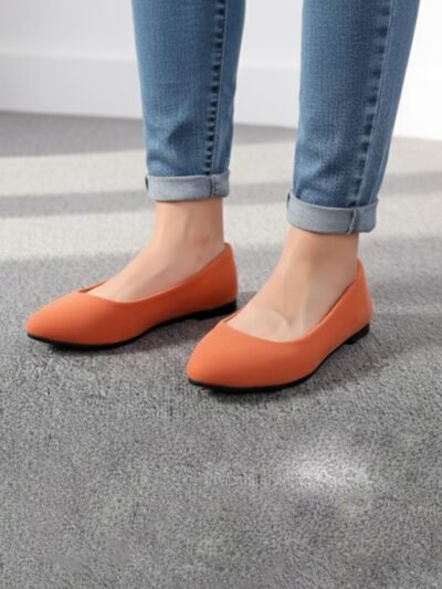 woman wearing orange flats