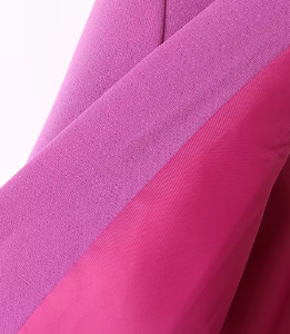 the fabric of the pink blazer