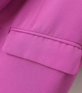 the pocket of the pink blazer