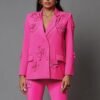 woman wearing pink blazer with appliques