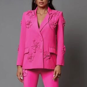 woman wearing pink blazer with appliques