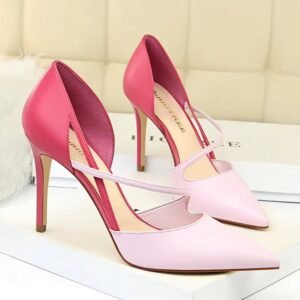 pink color heels standing in the white room