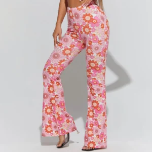 woman wearing pink floral pants on the white background