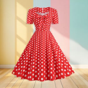 red polka dress front view, pastel colored wall in the background