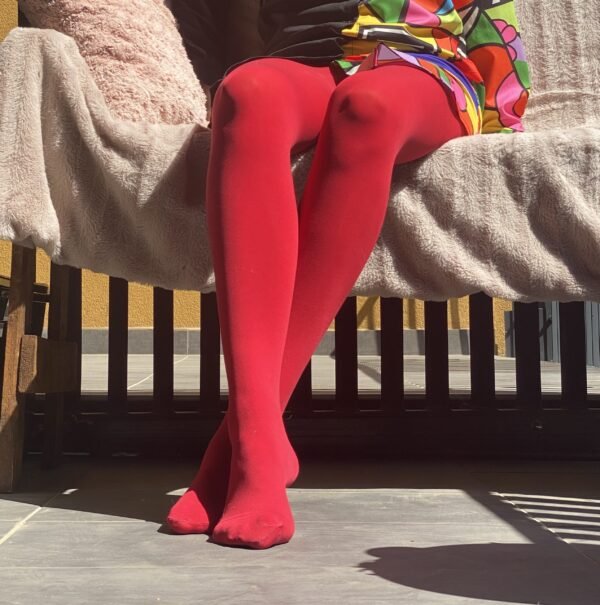 red tights front view on a model, crossed legs