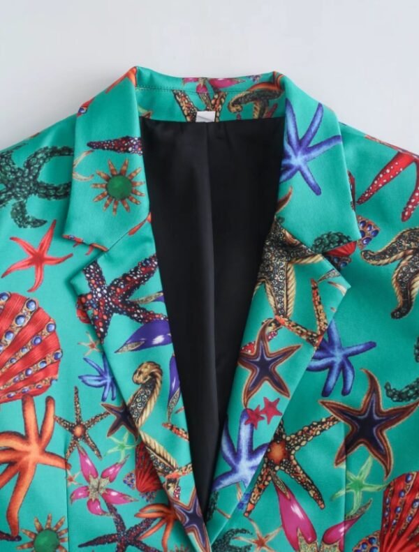 the collar of the turquoise blazer