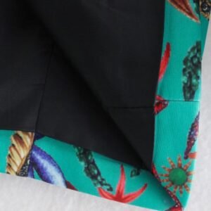 the fabric of the turquoise blazer