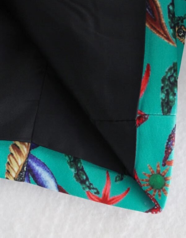 the fabric of the turquoise blazer