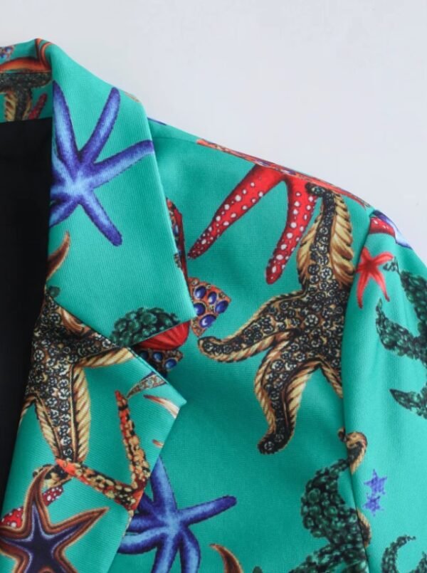 the shoulder part of the turquoise blazer