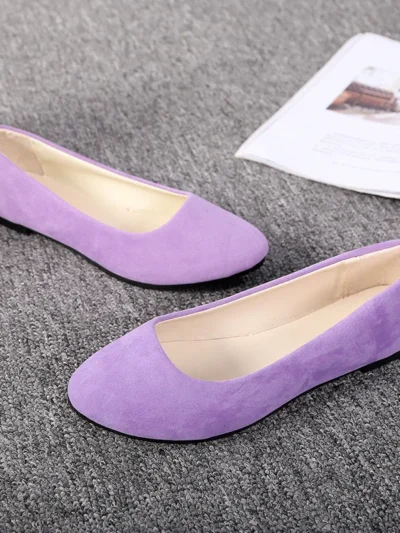 violet flats front view on a grey carpet