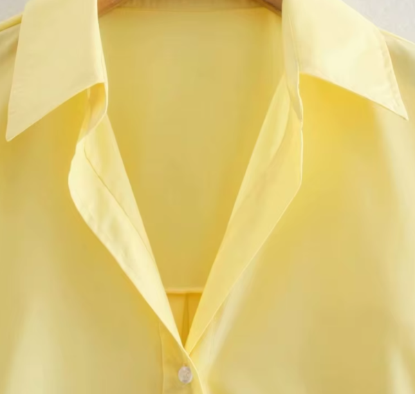 the collar of yellow blouse