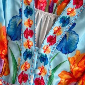 the buttons of the blue floral dress