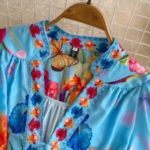 the collar of the blue floral dress