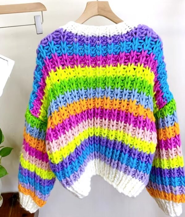 back side of the colorful knit cardigan hanging on a hanger