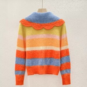 cute orange sweater turned to the back on the beige background