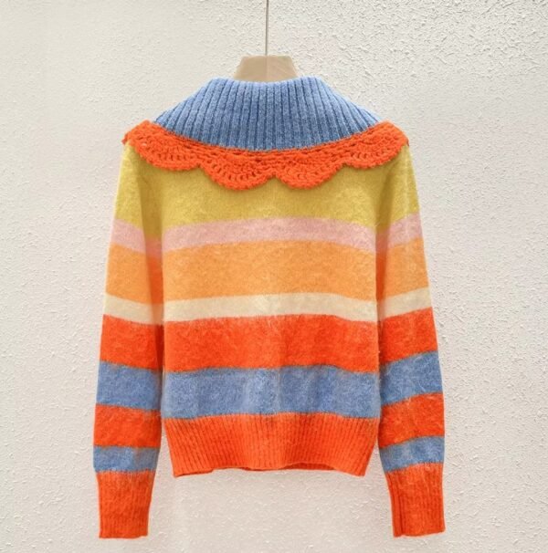 cute orange sweater turned to the back on the beige background