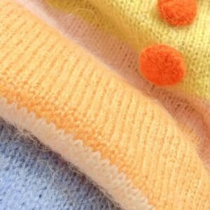 the fabric of the cute orange sweater