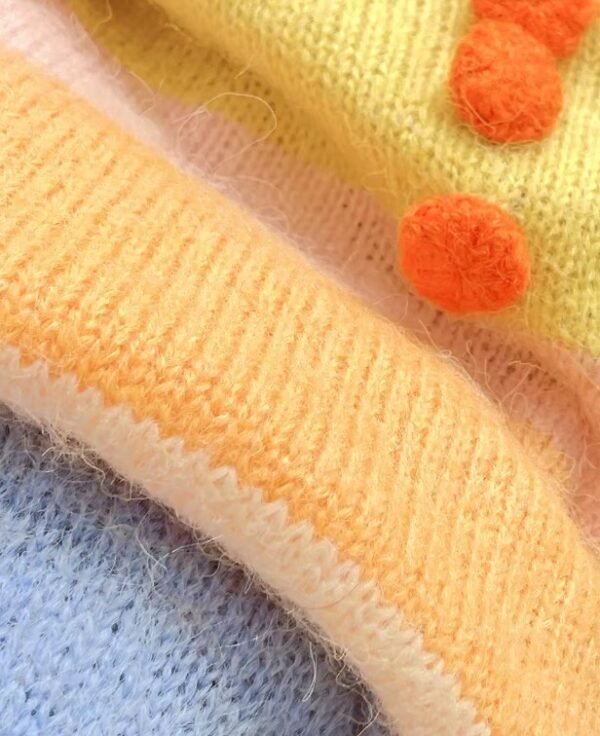 the fabric of the cute orange sweater