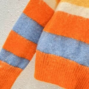 the sleeve of the cute orange sweater