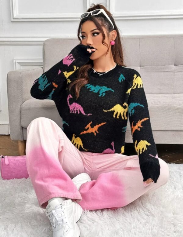 woman sitting on the carpet and wearing dinosaur sweater and pink pants