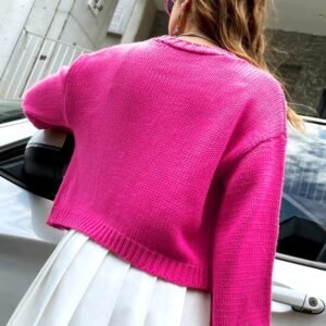 woman turned to her back wearing pink floral cardigan