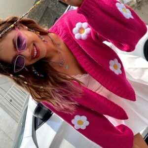 woman wearing floral cardigan and pink glasses