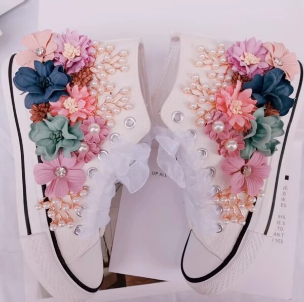 floral sneakers laying in the white box