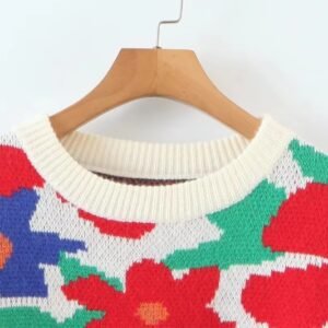 the collar of the floral sweater hanging on a hanger