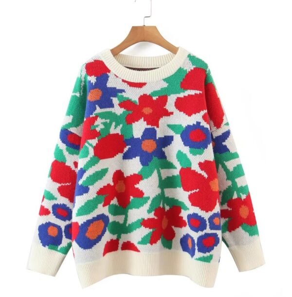 floral sweater hanging on a hanger on the white background