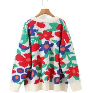 the back side of the floral sweater hanging on a hanger on the white background