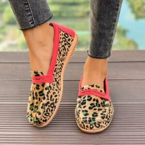 woman wearing leopard print loafers