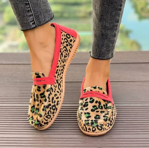 woman wearing leopard print loafers