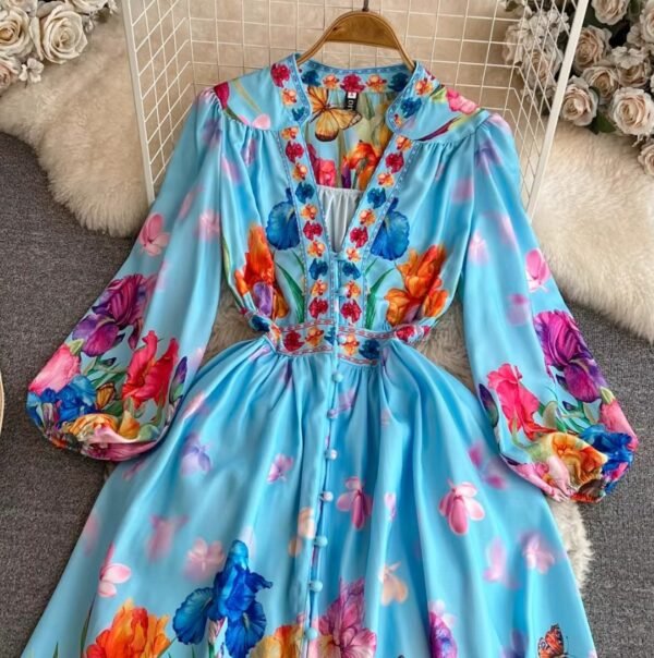 the upper part of the blue floral dress