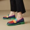 woman wearing multicolor loafers