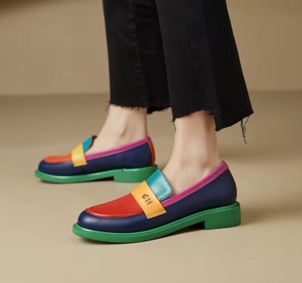 woman wearing multicolor loafers