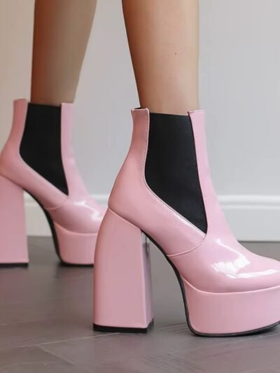 pale pink boots side and front view, white wall behind them